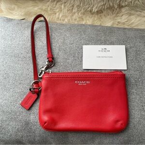 COACH New York orange wristlet